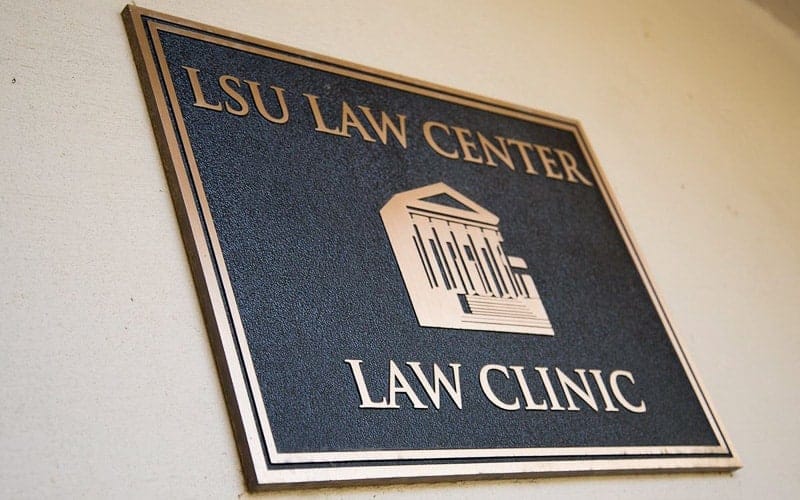 brushed cast bronze plaque for law clinic outside wall