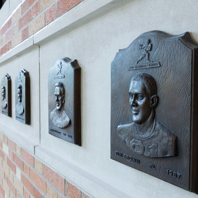 cast bronze plaque in oxidized finish with bas relief scuplted 3d portrait for notre dame football
