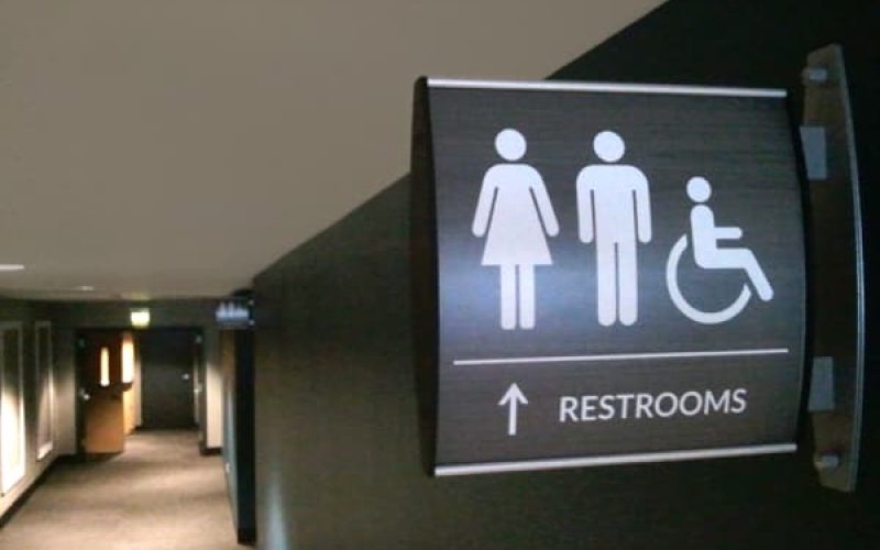 curved-projecting-sign-restroom.jpg